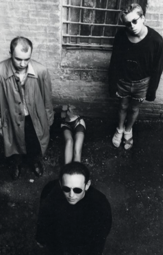 In the courtyard of Parkom Squat in Kyiv. Artists Maksym Mamsikov, Kyrylo Protsenko, and Oleh Holosii (on the right). 1991. Photo by Mykola Trokh. From the archive of Oleksandr Soloviev. Courtesy of Oleksandr Soloviev.