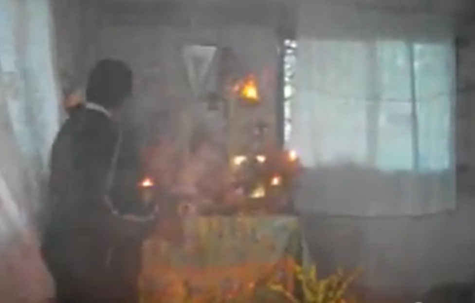 Figure 4. Copal smoke enveloping the family altar in Tecomate. Photograph by Sabina Cruz de la Cruz.