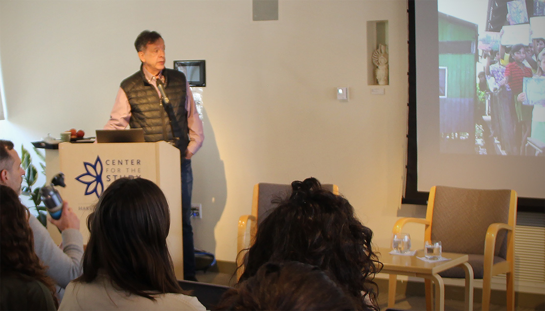 Dr. Luis Eduardo Luna at the podium presenting