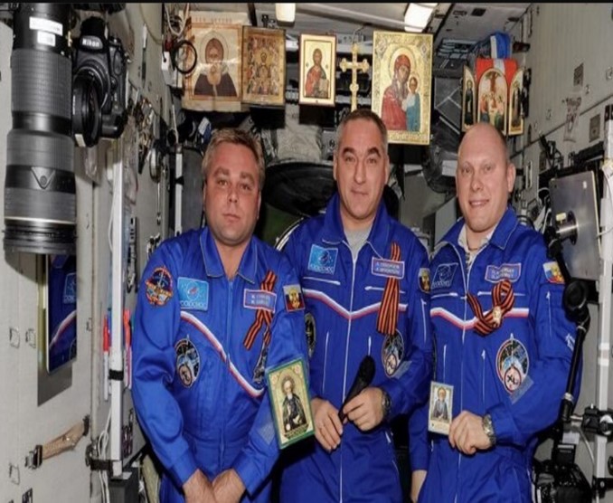 Photo of three astronauts inside the space ship