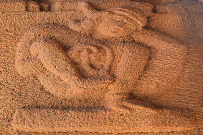 Picture of sculpted figure in complex yogic posture