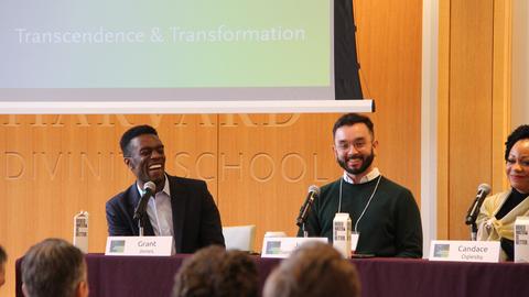 A panel discussion with smiling and laughing panelists at Harvard Divinity School