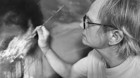 Michael Prettyman painting a canvas