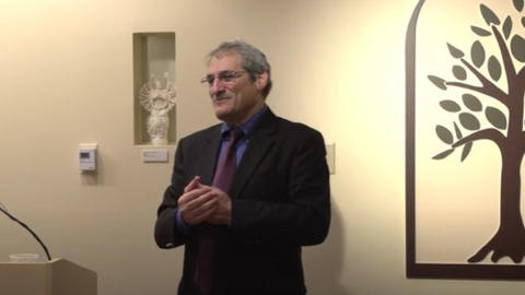 Professor Steve Kepnes speaks in the CSWR Common Room.