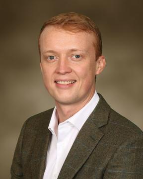 Headshot of scholar Tim Grieve Carlson