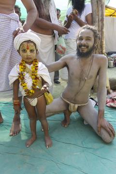 Young boy with father and people in the background