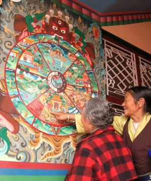 "Wheel of life Didactic." A delog teaches about the different realms in life and death as depicted in a mandala