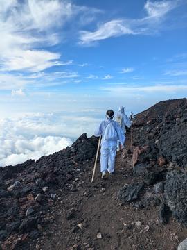 men walking along a mountain trail