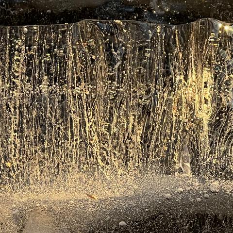 Close-up photo of light shining through ice