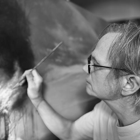 Michael Prettyman painting a canvas