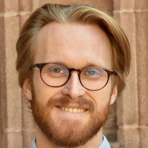 Matthew Andrews smiling into the camera
