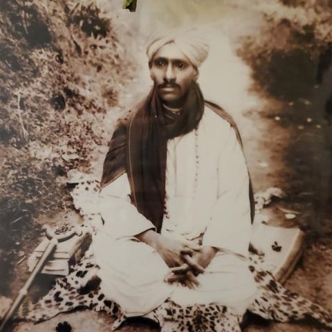 Om Prakash Swamigal as a younger swami seated