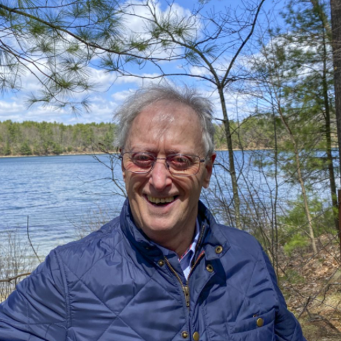 Robert Gross, smiling in front of Walden Pond