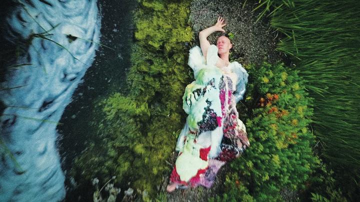 Figure 2. The author wearing a stink-inspired dress designed for him by Matty Bovan (2020), as featured in a performance-lecture at Harvard University, 15 May 2025.