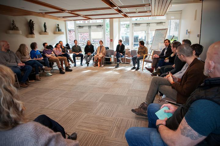 Workshop participants seated in a circle 