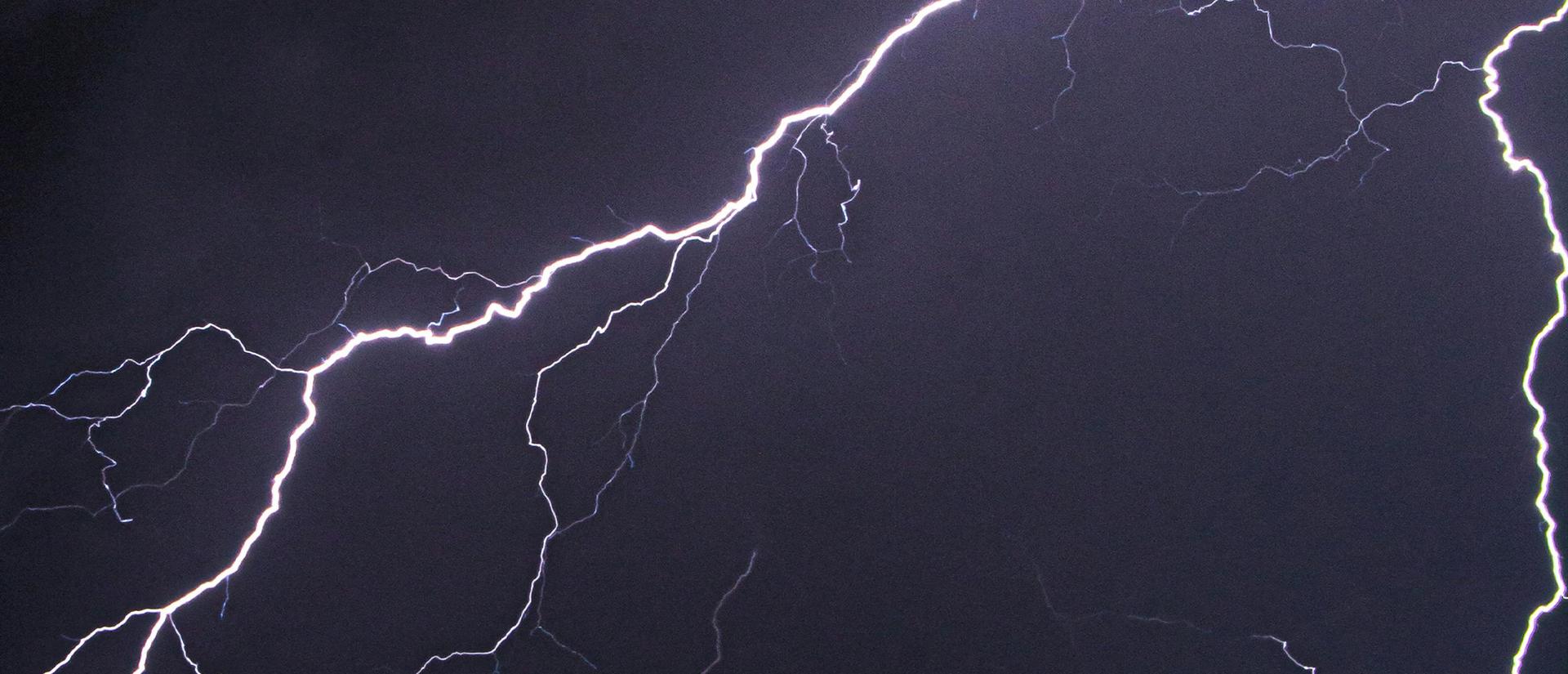 Lightning bolt in a dark purple sky