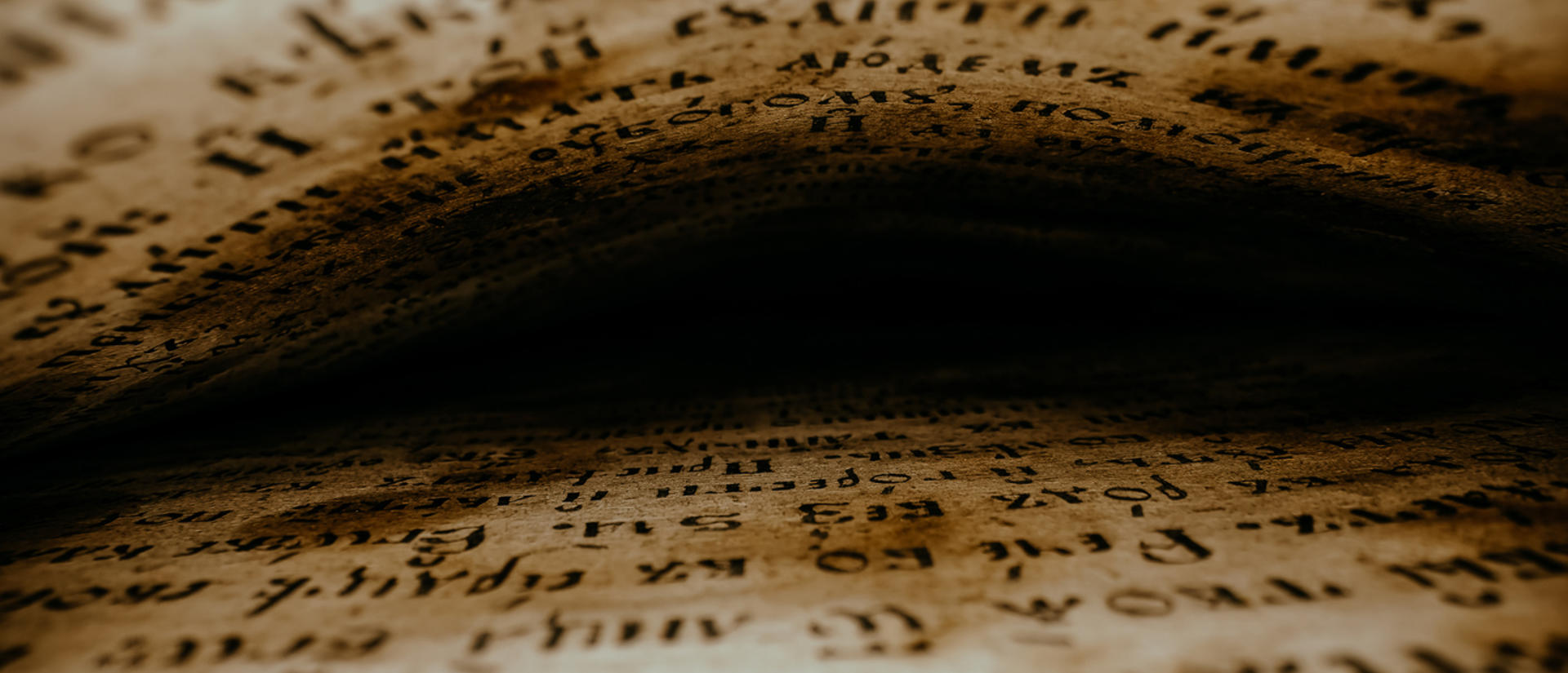 Ancient text looking between the pages