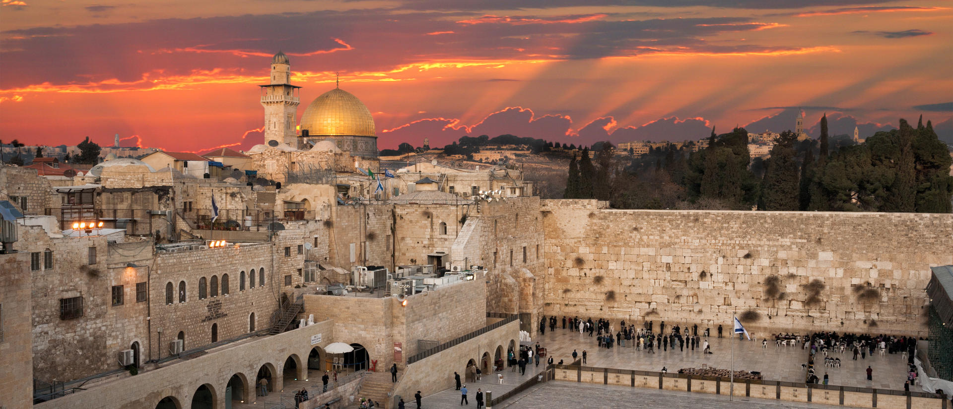 View of the Western Wall in Israel with sun set in the distance