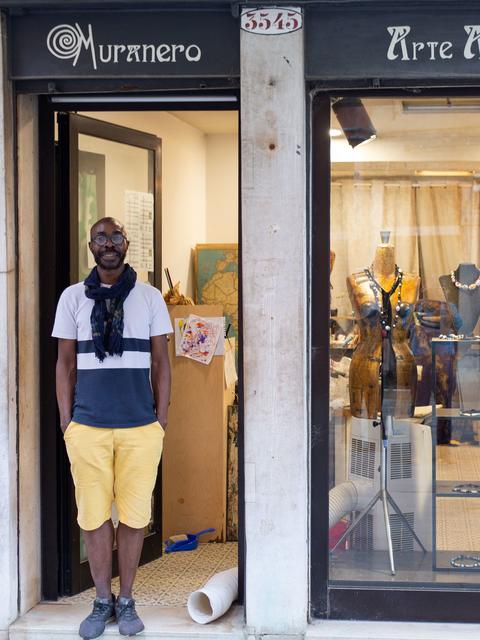 Moulaye Niang standing in front of his shop