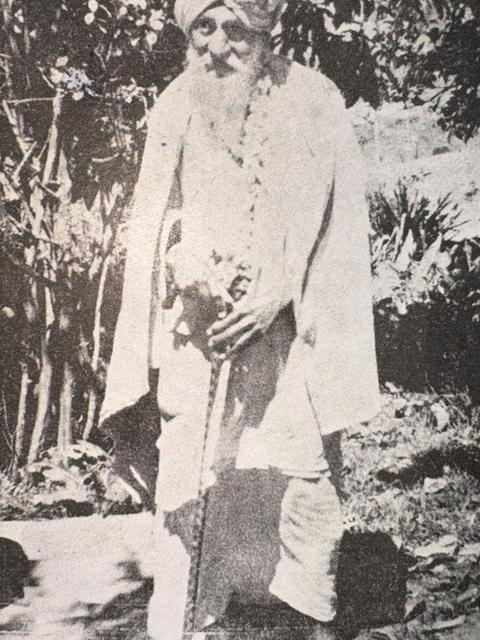 Om Prakash Swamigal as an older swami, standing with walking stick