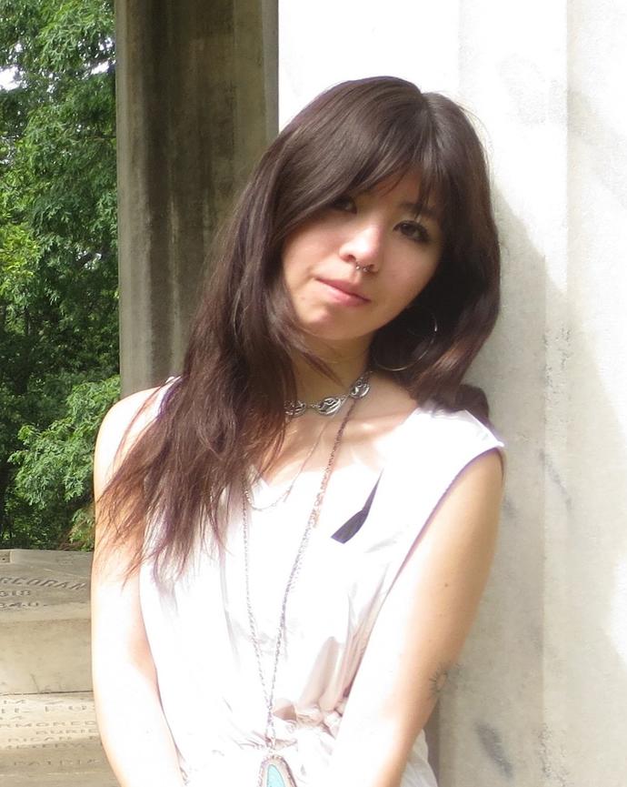 Nami Bolat looking into the camera. Head tilted slightly.